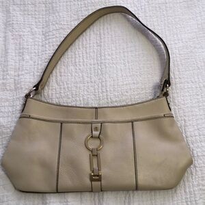 Etienne Aigner cream colored leather handbag.